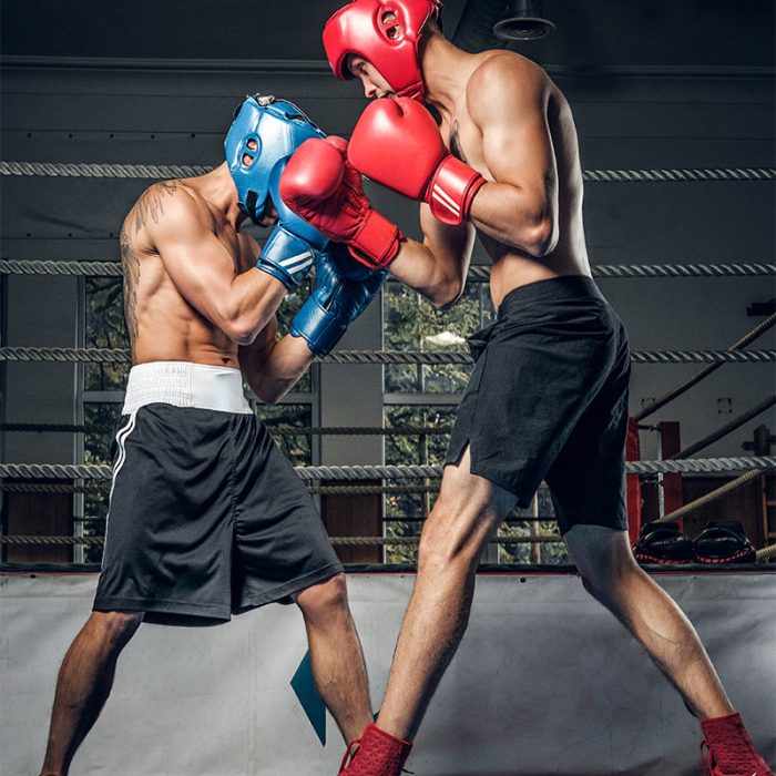 two-muscular-boxers-have-competition-ring-they-are-wearing-helmets-gloves